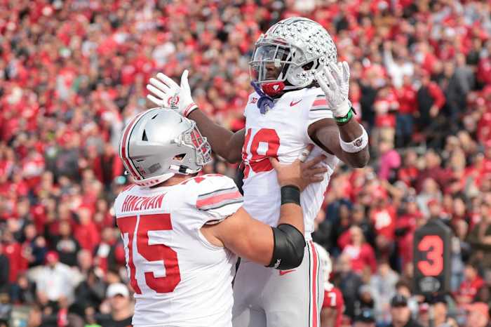 Ohio State Buckeyes wide receiver Marvin Harrison Jr. (18) celebrates with offensive lineman Carson Hinzman (75) after scoring touchdown against the Rutgers Scarlet Knights during the second half at SHI Stadium.